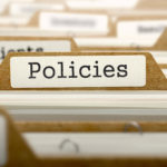 Policies Concept. Word on Folder Register of Card Index. Selective Focus.